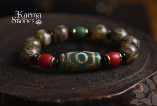 DB-25-001-02-scaled-1.jpg Green Dzi Bead with Red Bead Ornaments