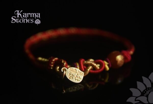 Red Tibetan-Style Braided Bracelet with a Golden Good-Luck Pendant